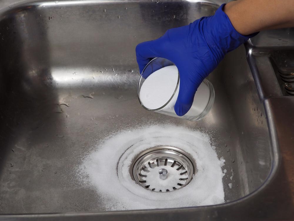 Chemical cleaner being poured down the drain Everett, WA