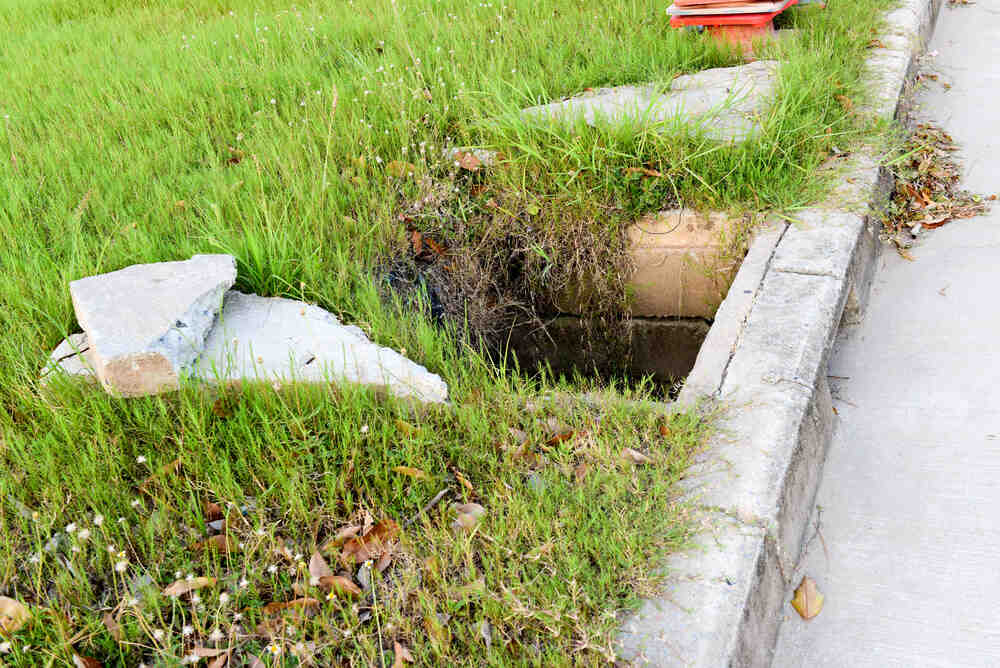 damaged sewer access in lawn